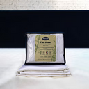 Bamboo flat sheet in white draped on a bed