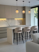 Arco bar stools styled at a kitchen island