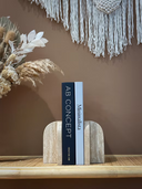 Travertine arched bookend showing natural stone pores and veining